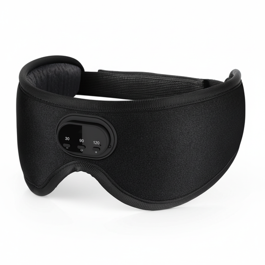 Black Bluetooth sleep mask with blackout eye coverage and front audio control panel on a white background