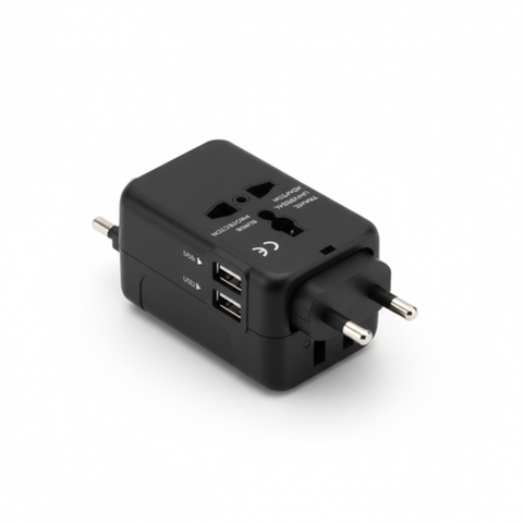 Black compact universal travel adapter showing plug formats, high-angle view on a white background